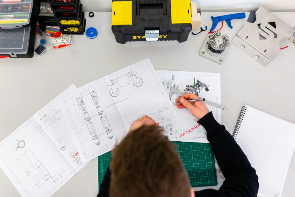 What civil engineers do, pay and how to become one 3 Male mechanical engineer designs agricultural robots